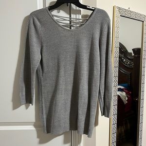 Long sleeve grey oversized sweater with a lace up back
